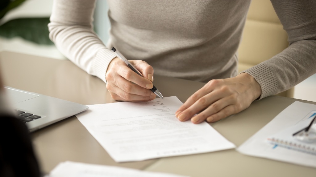 Woman filling out paperwork